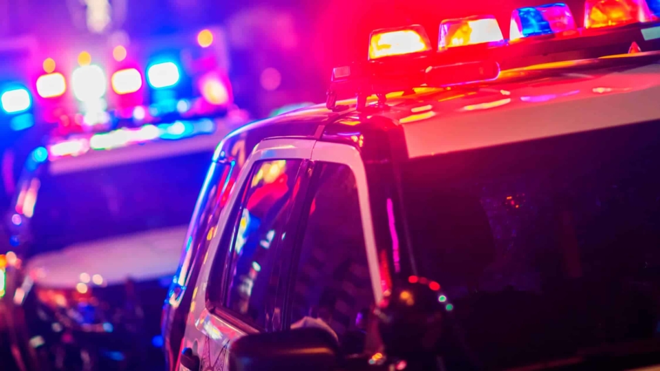Police vehicles with lights flashing